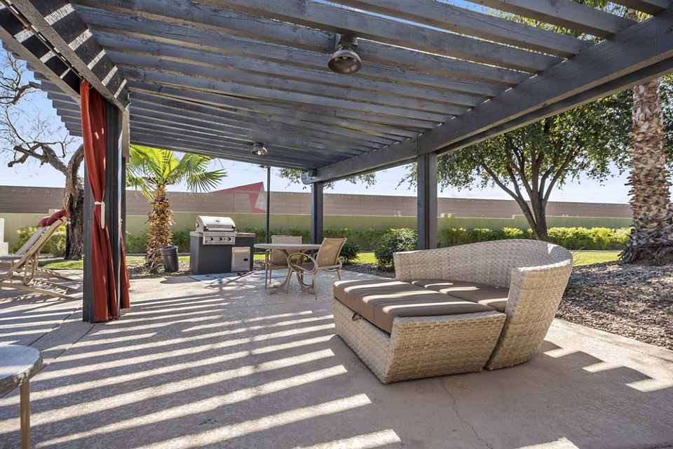 Grill area at San Riva at the Foothills Apartments with modern barbecue stations and outdoor seating Ideal for hosting gatherings