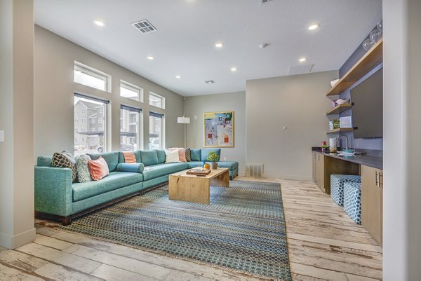 Clubhouse featuring modern design and entertainment spaces at Bria Apartments