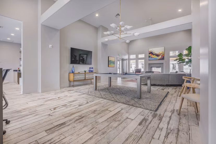 Clubhouse featuring modern design and ample seating at Bria Apartments, ideal for luxury living and social gatherings
