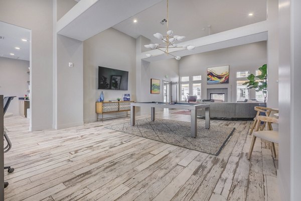 Clubhouse featuring modern design and ample seating at Bria Apartments, ideal for luxury living and social gatherings