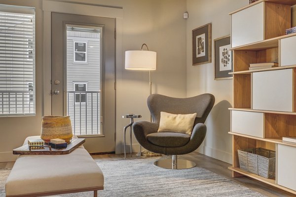 Cozy living room with stylish decor at Bria Apartments, ideal for relaxation in modern luxury living