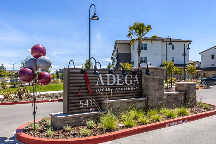 Adega Apartments: Elegant signage highlighting luxury living in downtown Bethesda