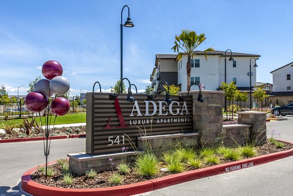 Adega Apartments: Elegant signage highlighting luxury living in downtown Bethesda