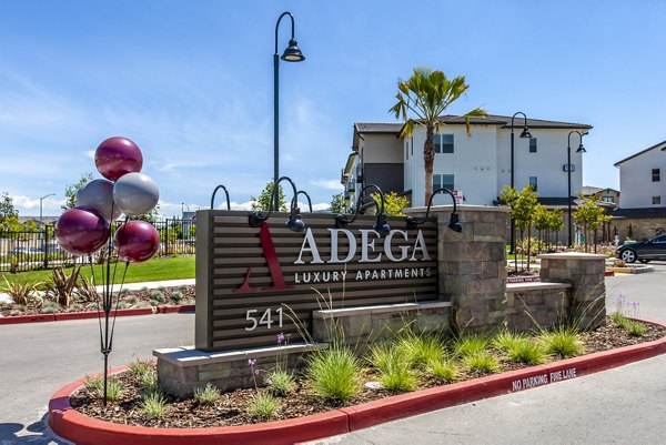 signage at Adega Apartments