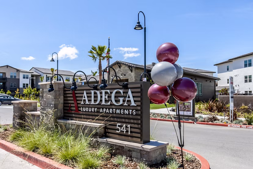 Adega Apartments: Modern signage at luxury apartments in downtown Silver Spring, enhancing the community's upscale experience