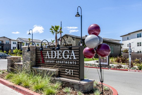 Adega Apartments: Modern signage at luxury apartments in downtown Silver Spring, enhancing the community's upscale experience