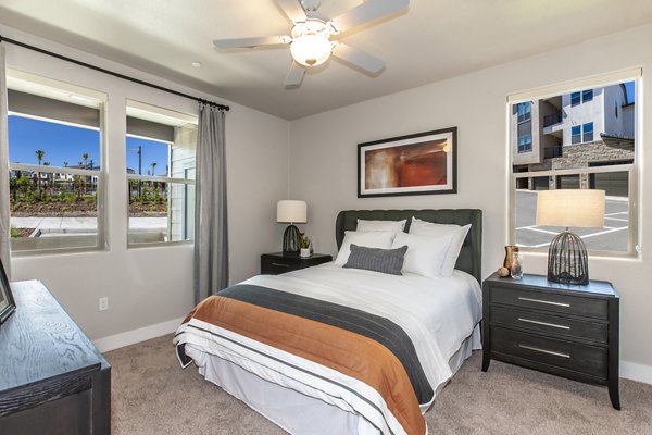 Cozy bedroom with modern design in Adega Apartments, San Francisco