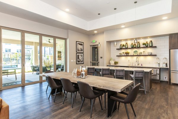 Clubhouse with modern design and comfortable seating at Adega Apartments, luxury community