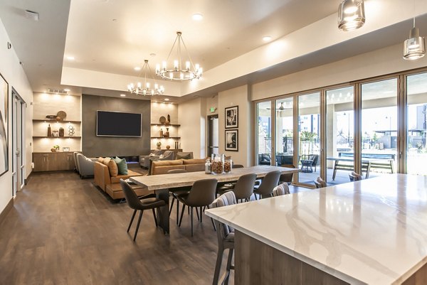 Elegant clubhouse with modern design at Adega Apartments, offering luxurious amenities for residents to enjoy social gatherings and events