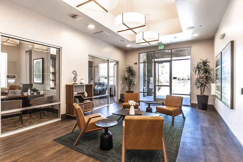 Clubhouse featuring modern design and cozy seating at Adega Apartments