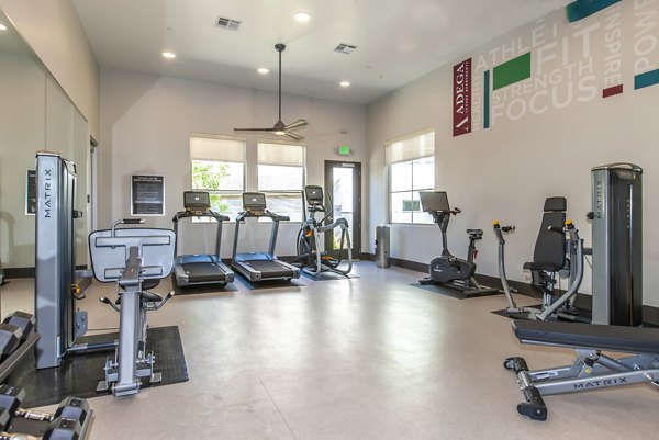 fitness center at Adega Apartments