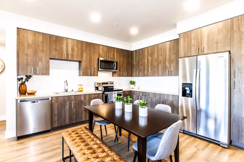 Modern kitchen with stainless steel appliances at Adega Apartments