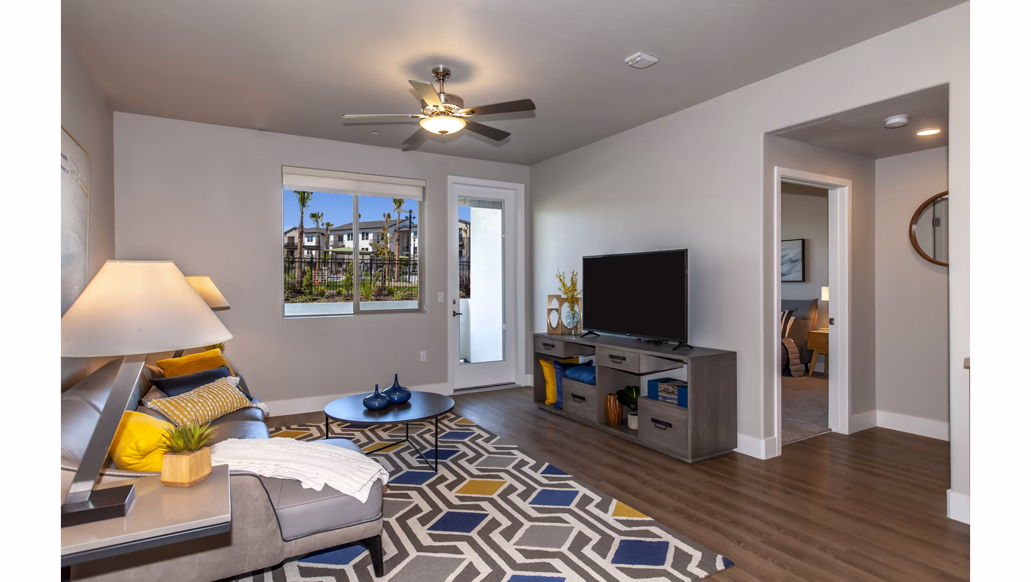 Modern living room with plush seating and artwork at Adega Apartments luxury residences