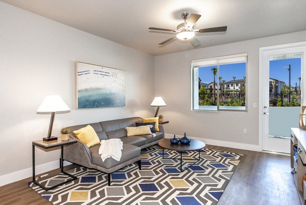 Cozy living room with sleek modern dÃ©cor in Adega Apartments, perfect for relaxation and socializing in a stylish setting