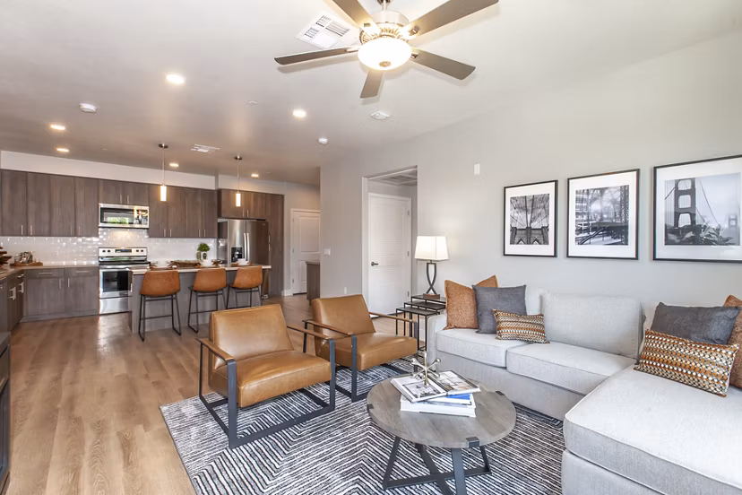 Spacious living room with modern decor and natural light in Adega Apartments