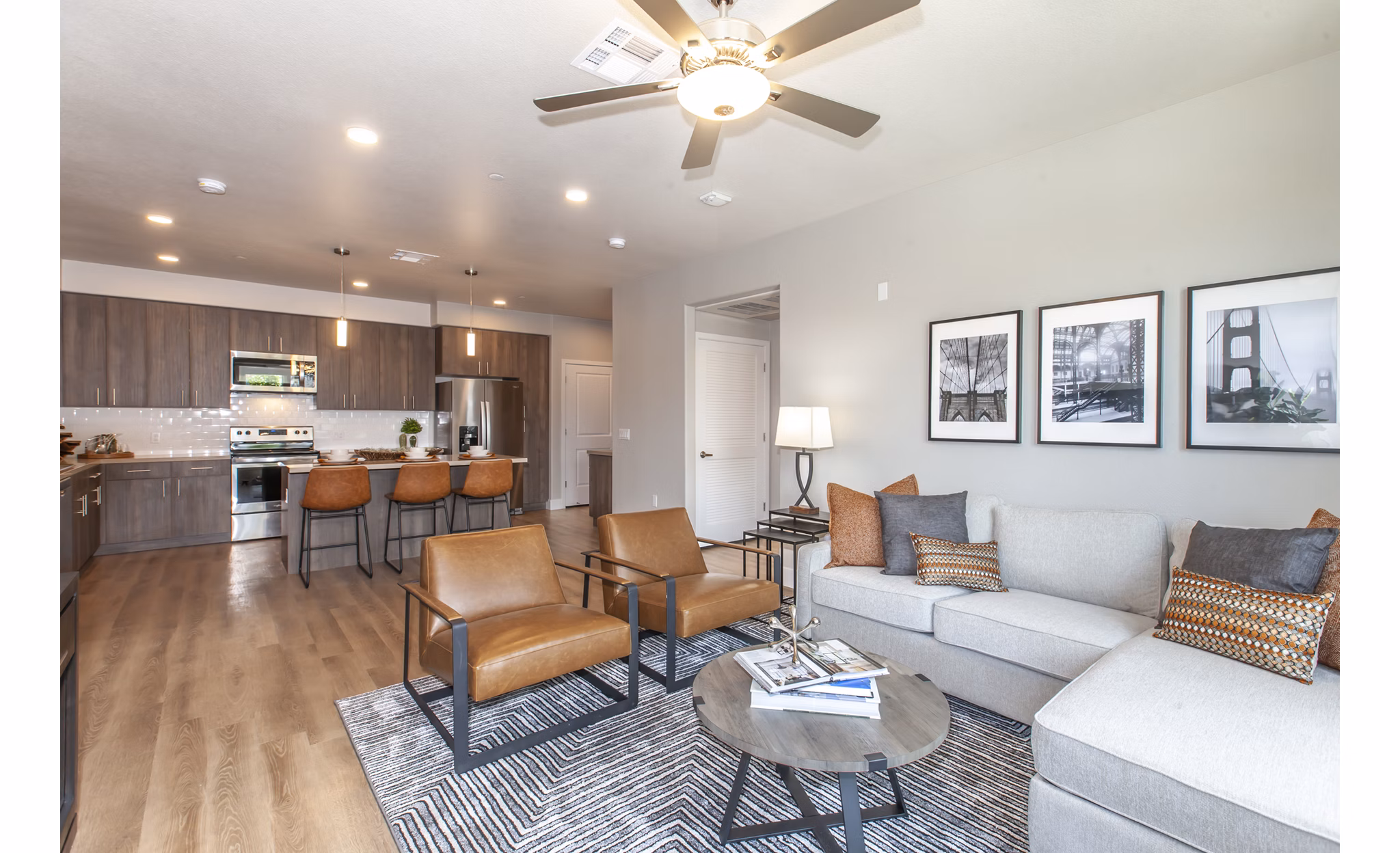 Spacious living room with modern decor and natural light in Adega Apartments