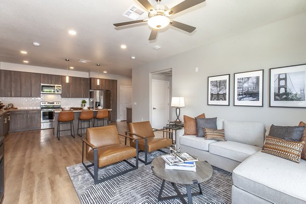 Spacious living room with modern decor and natural light in Adega Apartments
