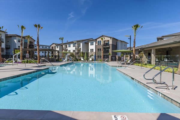 Rooftop infinity pool with panoramic views at Adega Apartments