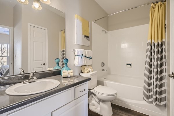 Bathroom featuring modern fixtures and elegant marble countertops in The Fairways at Raccoon Creek apartments