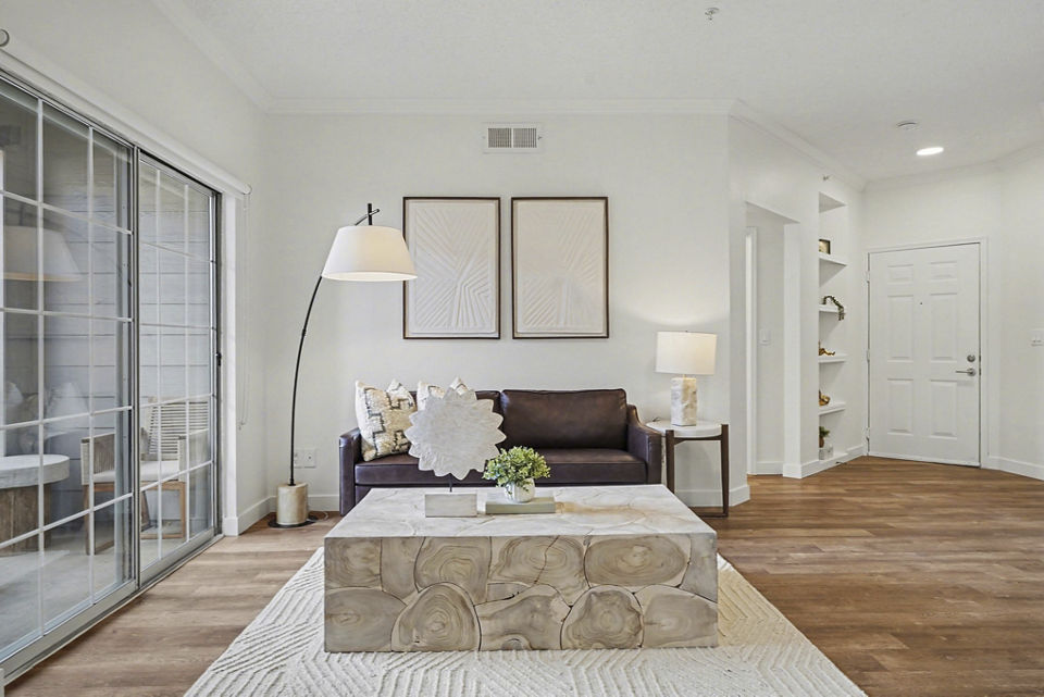Spacious living room with modern decor at The Fairways at Raccoon Creek luxury apartments