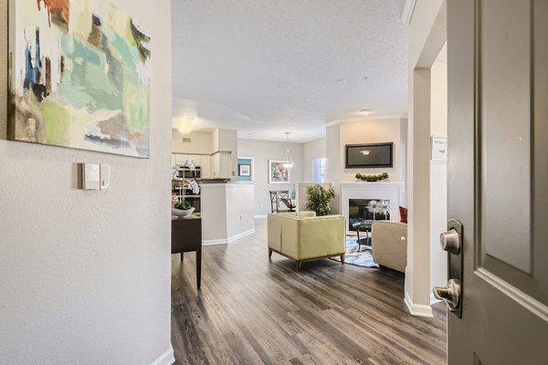 Spacious living room with elegant furnishings at The Fairways at Raccoon Creek luxury apartments