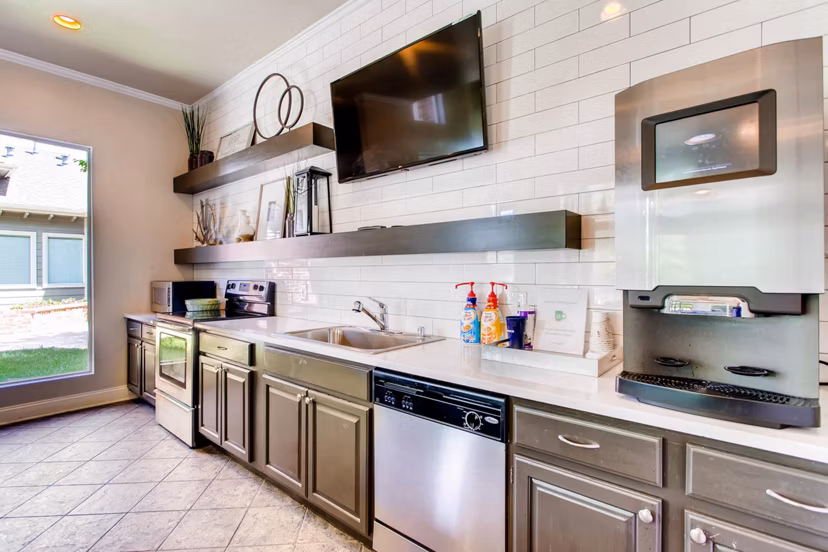 Clubhouse featuring a modern lounge and fireplace at Mountain Gate Apartments