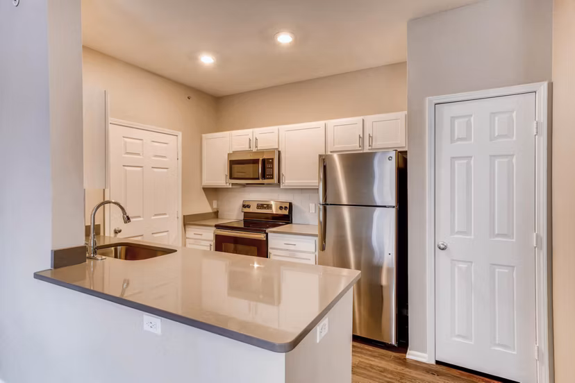 Contemporary kitchen with stainless steel appliances at Mountain Gate Apartments