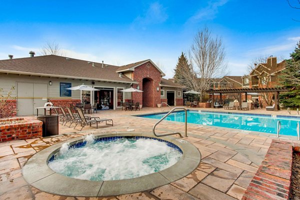 Resort-style pool at Mountain Gate Apartments with luxurious lounging areas and scenic views