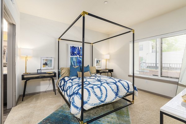 Contemporary bedroom with stylish decor at LINQ Midtown Apartments, luxury living space in a prime urban location