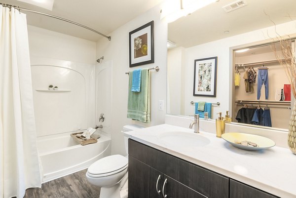 Modern bathroom with sleek fixtures at LINQ Midtown Apartments - luxury living in a Greystar-managed property