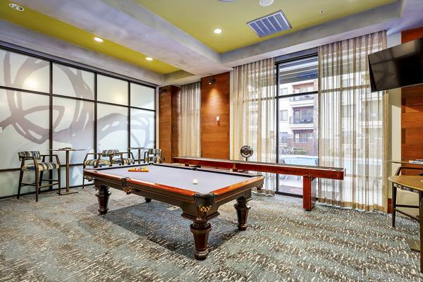 pool table in clubhouse at LINQ Midtown Apartments