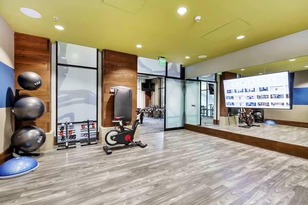 fitness center at LINQ Midtown Apartments