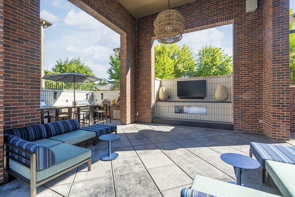 Patio area with modern seating at LINQ Midtown Apartments offering luxury living options