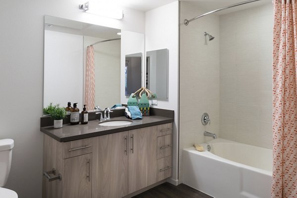 Modern bathroom with sleek fixtures at Garey Building Apartments in a luxury Greystar property