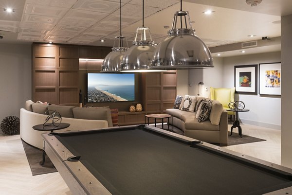 Game room with billiards and lounge seating at Garey Building Apartments in downtown LA