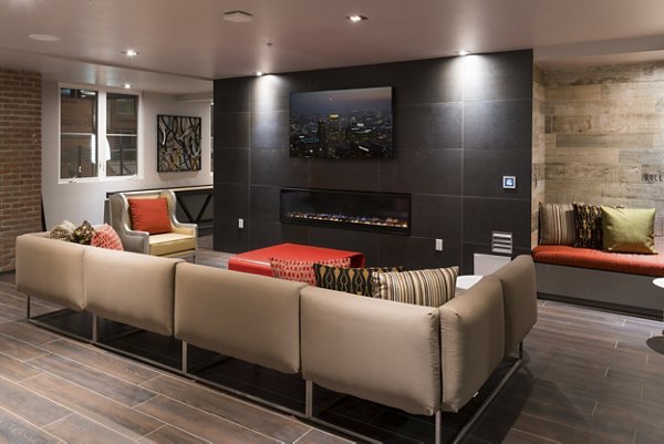 Clubhouse featuring modern design and cozy seating at Garey Building Apartments
