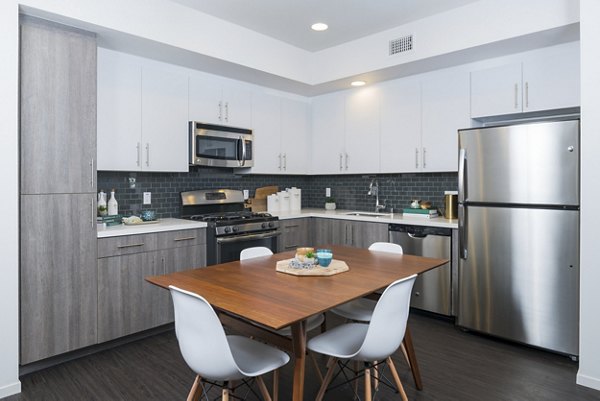 Dining area with modern decor at Garey Building Apartments, luxury living in a vibrant community