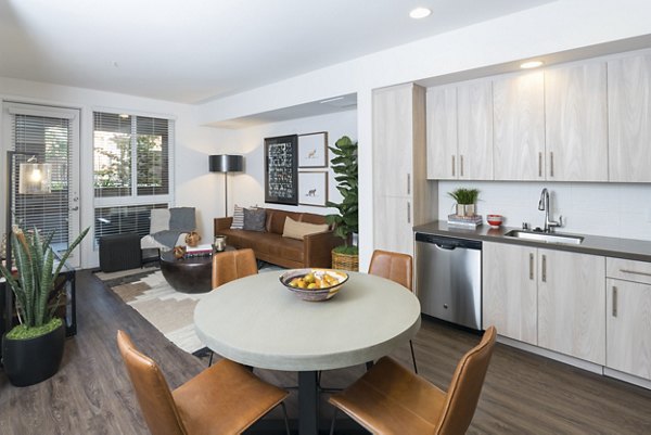 Dining area featuring modern decor and ample seating in Garey Building Apartments, Los Angeles