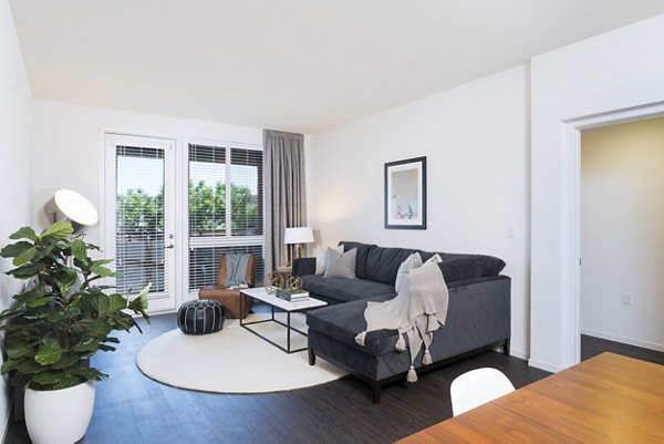 Spacious living room with modern furnishings at Garey Building Apartments, ideal for luxury living in Greystar communities