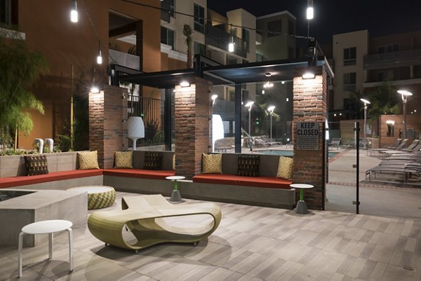 Garey Building Apartments: Tranquil courtyard featuring lush landscaping and seating areas in downtown Los Angeles