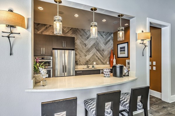 Clubhouse with modern decor at Jefferson at Carmel Mountain Ranch Apartments offering luxury living in a vibrant community