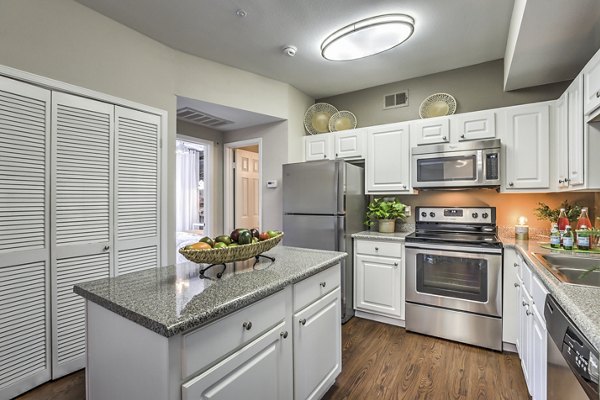 Modern kitchen featuring stainless steel appliances at Jefferson at Carmel Mountain Ranch Apartments