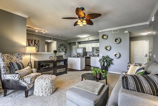 Living room with modern furnishings and ample natural light at Jefferson at Carmel Mountain Ranch Apartments, luxurious spaces designed for comfort