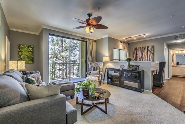 Spacious living room with modern furnishings in Jefferson at Carmel Mountain Ranch Apartments