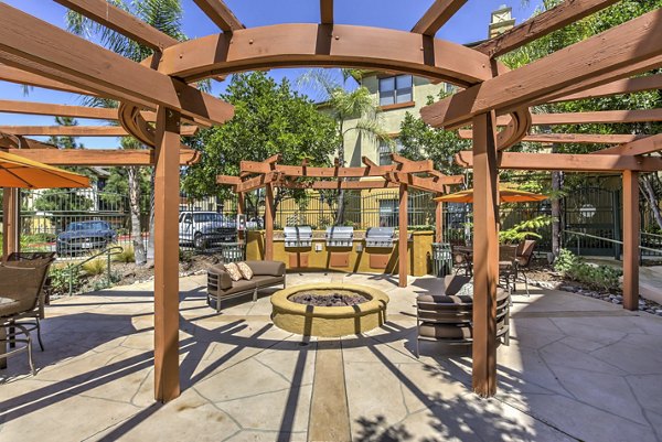 Cozy fire pit area at Jefferson at Carmel Mountain Ranch Apartments, perfect for outdoor gatherings and relaxation