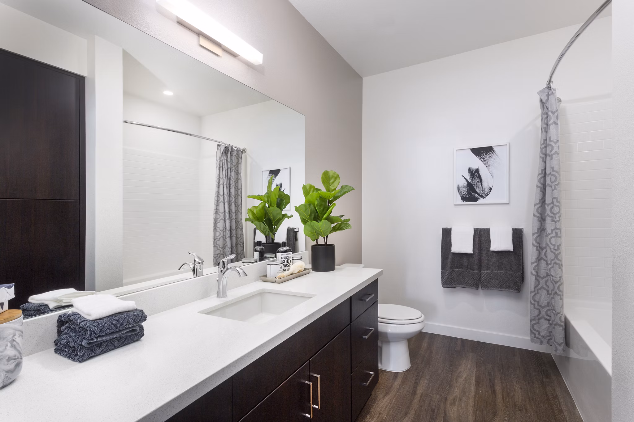 Elegant bathroom featuring granite countertops and modern fixtures in Aspect Apartments