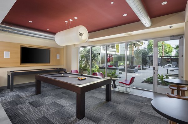 Aspect Apartments: Modern clubhouse with elegant design and seating area in luxury setting