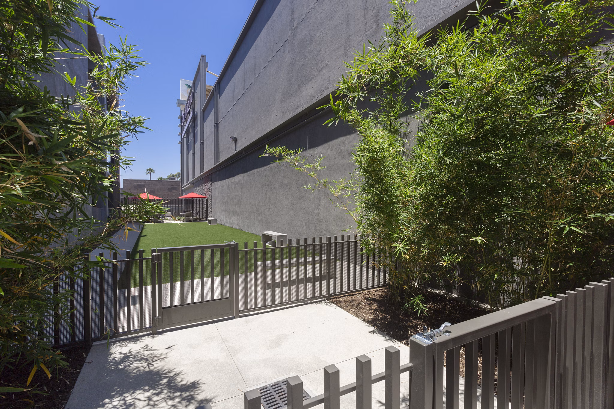 Secure, fenced dog park with agility equipment at Aspect Apartments for residents and their pets