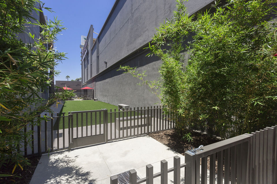 Secure, fenced dog park with agility equipment at Aspect Apartments for residents and their pets