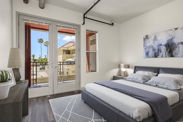 Bedroom featuring modern decor and natural lighting at San Pedro Bank Lofts luxury apartments
